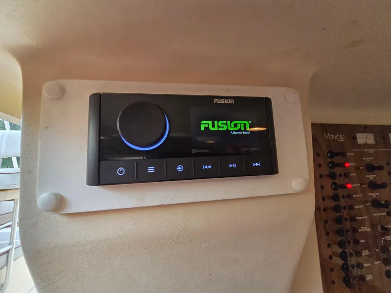 Slide: The Image of Fusion stereo system on 2001 Mainship Pilot 30 Sedan boat dashboard. - 27