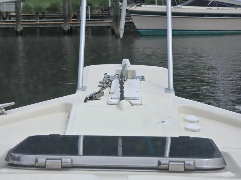 Slide: The Image of Bow view of 2001 Mainship Pilot 30 Sedan at dock, featuring anchor and hatch. - 31