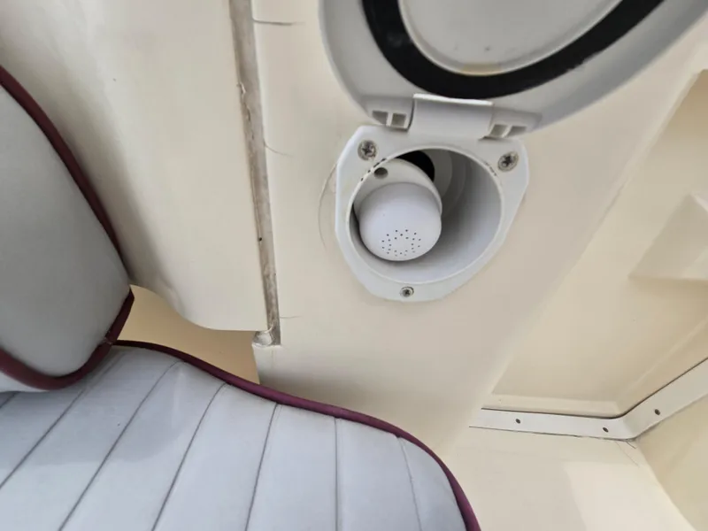 Slide: The Image of 2001 Mainship Pilot 30 Sedan interior detail with vent and cushioned seating. - 32