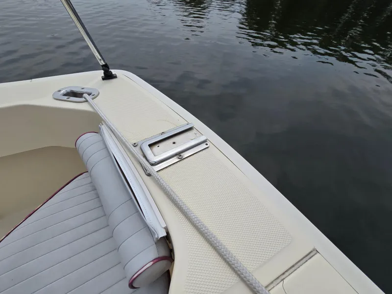 Slide: The Image of 2001 Mainship Pilot 30 Sedan boat deck with seating and water view. - 33