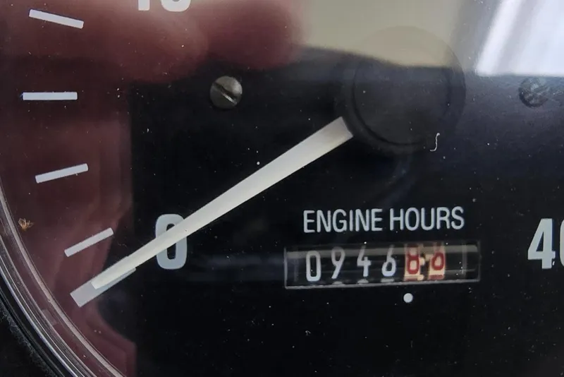 Slide: The Image of Close-up of 2001 Mainship Pilot 30 Sedan engine hour meter showing 946 hours. - 37