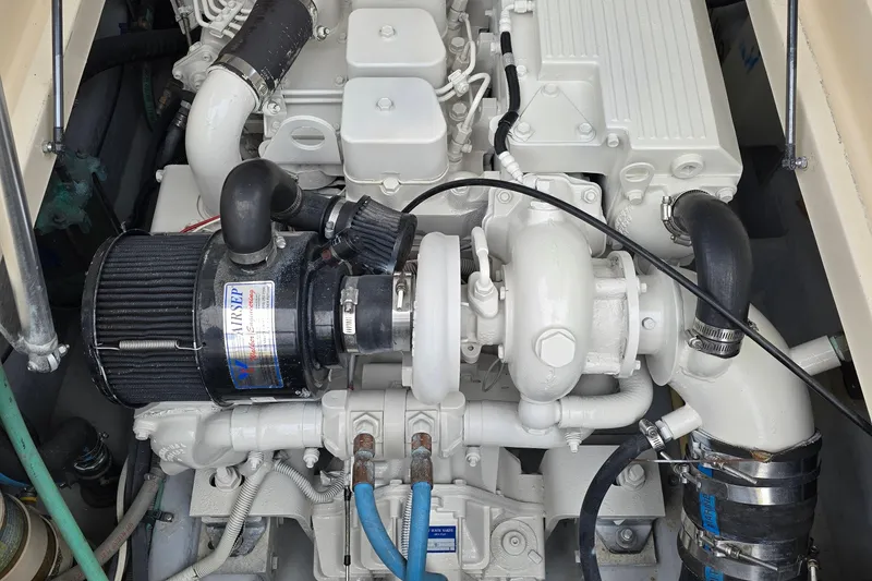 Slide: The Image of Engine compartment of a 2001 Mainship Pilot 30 Sedan boat, showcasing detailed components. - 38