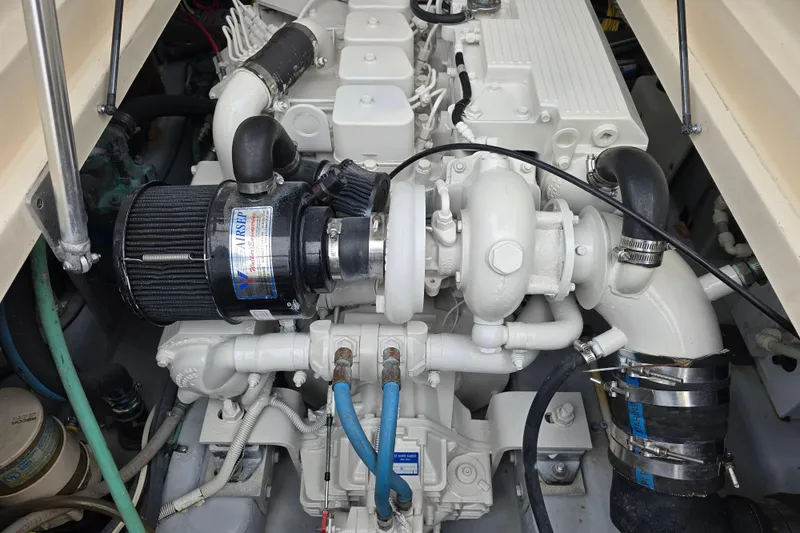 Slide: The Image of Engine compartment of a 2001 Mainship Pilot 30 Sedan boat, showcasing detailed components. - 39