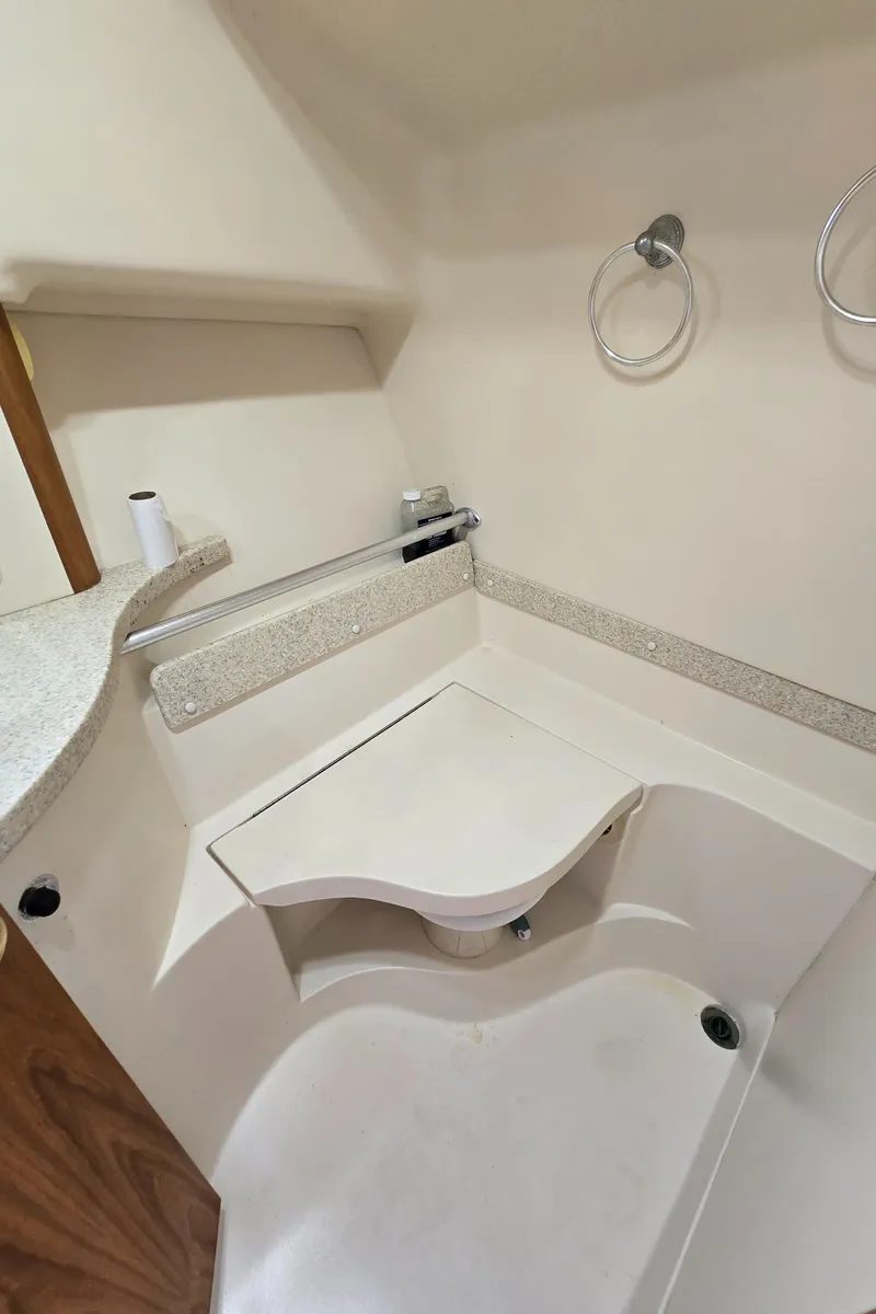 Slide: The Image of 2001 Mainship Pilot 30 Sedan bathroom with compact design and modern fixtures. - 40
