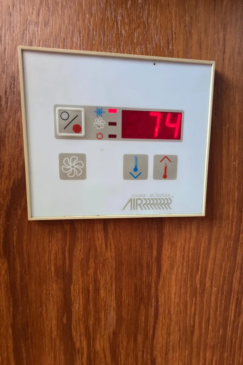 Slide: The Image of Digital thermostat on Mainship Pilot 30 Sedan, displaying 74 degrees. - 44