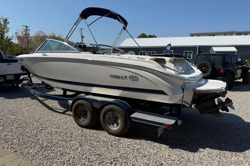 Slide: The Image of 2017 Cobalt 220S boat on trailer, parked outdoors on gravel. - 5