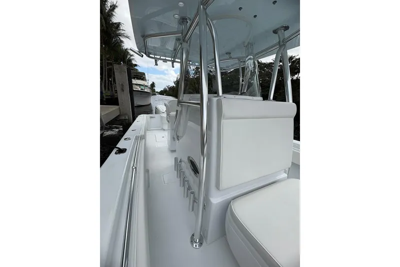 Slide: The Image of 2026 Contender 32 ST boat interior with sleek white seating and polished metal accents. - 22