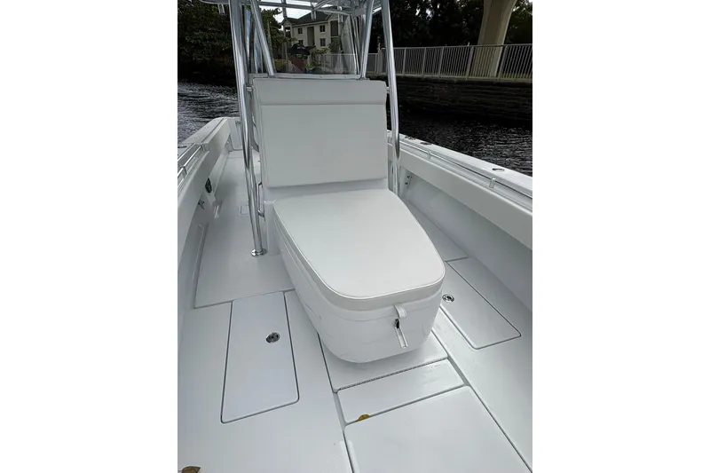 Slide: The Image of 2026 Contender 32 ST boat interior with sleek white seating and storage compartments. - 9