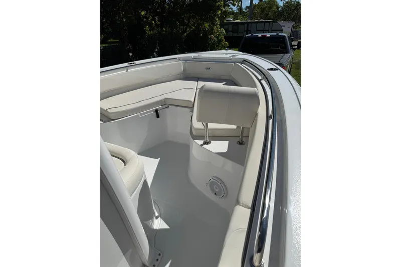 Slide: The Image of 2025 Sea Hunt Ultra 239 SE boat interior with cushioned seating and sleek design. - 13