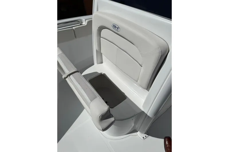 Slide: The Image of 2025 Sea Hunt Ultra 239 SE boat seat with storage compartment. - 21