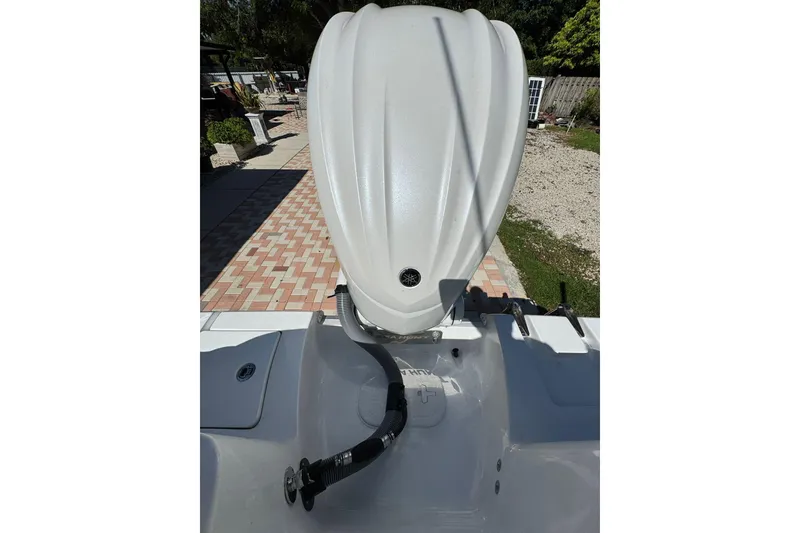 Slide: The Image of 2025 Sea Hunt Ultra 239 SE boat engine and deck view. - 23