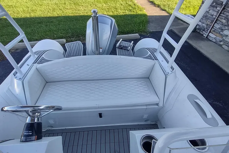 Slide: The Image of 2024 Valken 520 boat interior with white seating and modern steering wheel. - 6