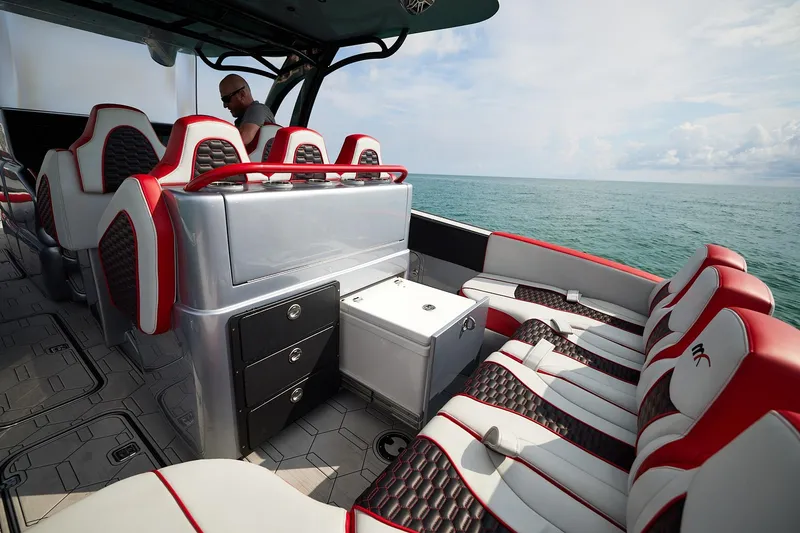 Slide: The Image of 2025 Midnight Express 37' Open boat interior with luxurious seating and ocean view. - 13