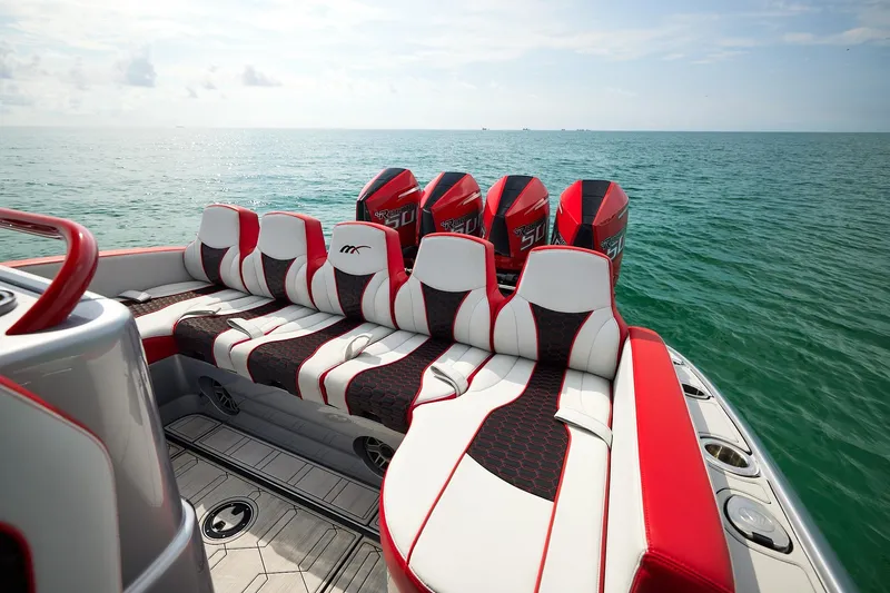 Slide: The Image of 2025 Midnight Express 37' Open boat with stylish seating and powerful engines on open water. - 14