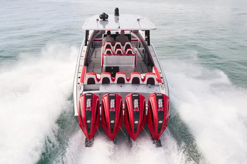 Slide: The Image of 2025 Midnight Express 37' Open boat with four powerful engines cruising on water. - 3