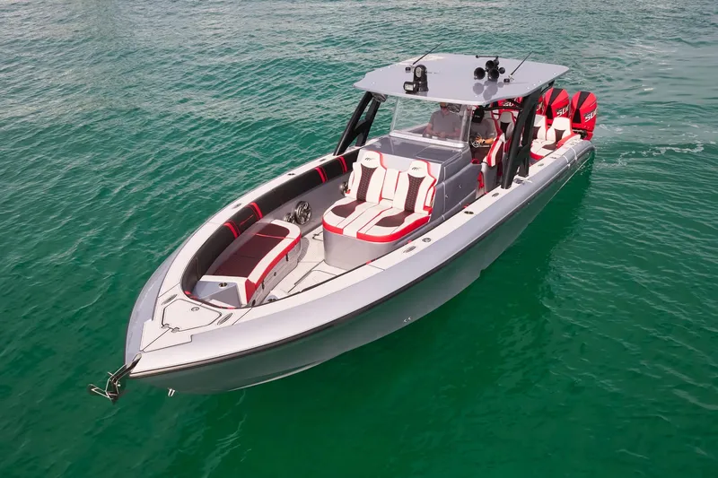 Slide: The Image of 2025 Midnight Express 37' Open boat on clear water, featuring sleek design and modern seating. - 4