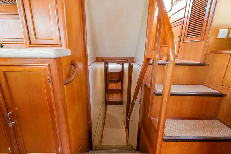 Slide: The Image of Interior of 1995 Fleming 55 yacht with wooden stairs and cabinetry. - 10