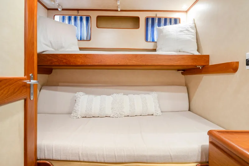 Slide: The Image of Cozy cabin interior with bunk beds on a 1995 Fleming 55 yacht. - 13