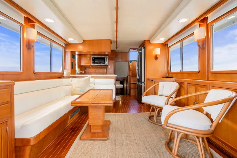 Slide: The Image of Luxurious 1995 Fleming 55 yacht interior with elegant wood finishes and comfortable seating. - 2