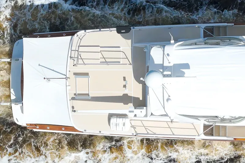 Slide: The Image of Aerial view of 1995 Fleming 55 yacht cruising through water. - 32