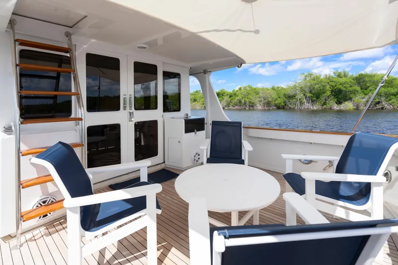 Slide: The Image of Outdoor seating area on 1995 Fleming 55 yacht with river view. - 34