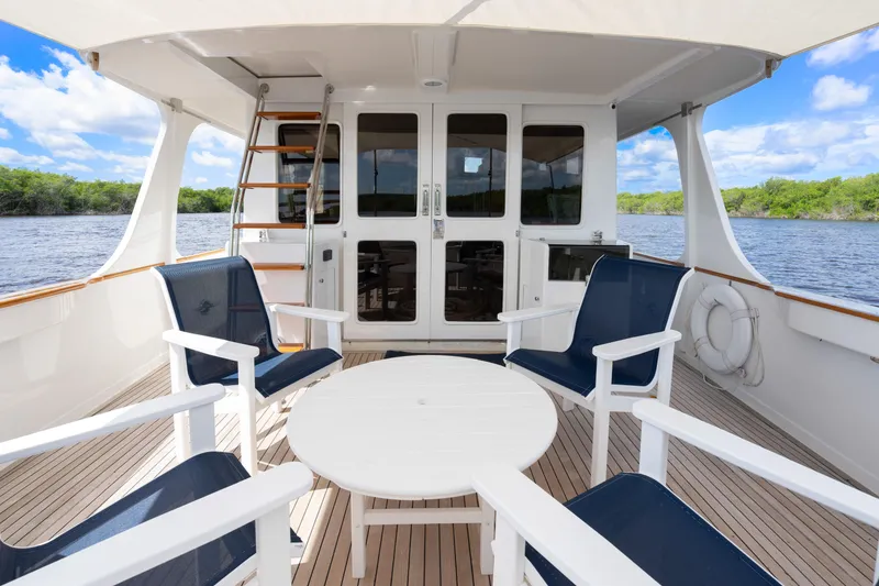 Slide: The Image of Spacious deck of a 1995 Fleming 55 yacht with seating and scenic water view. - 36