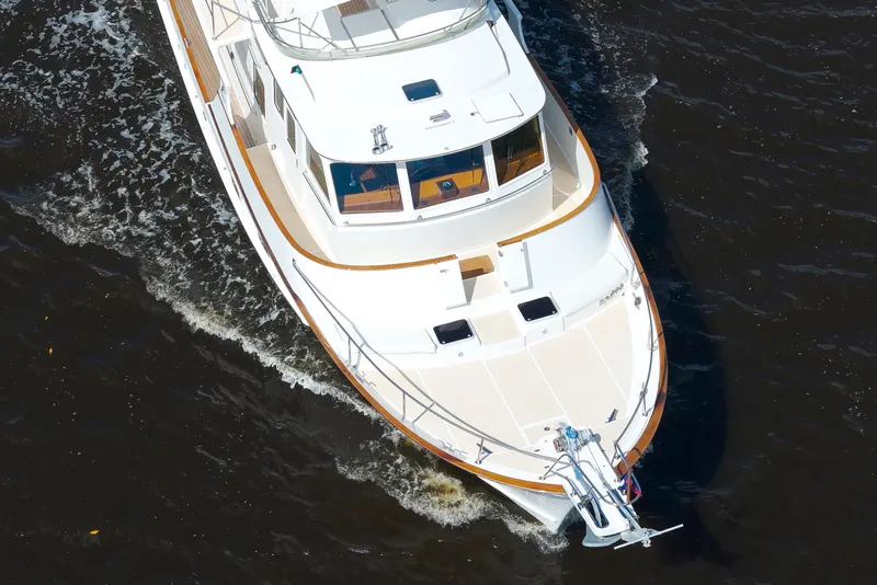 Slide: The Image of Aerial view of 1995 Fleming 55 yacht cruising on dark water. - 38