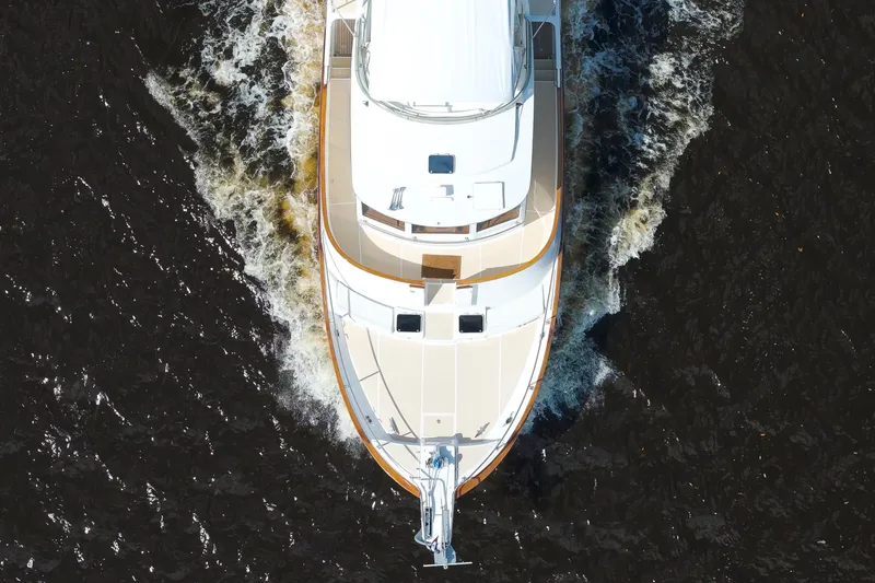 Slide: The Image of Aerial view of 1995 Fleming 55 yacht cruising through dark waters. - 42