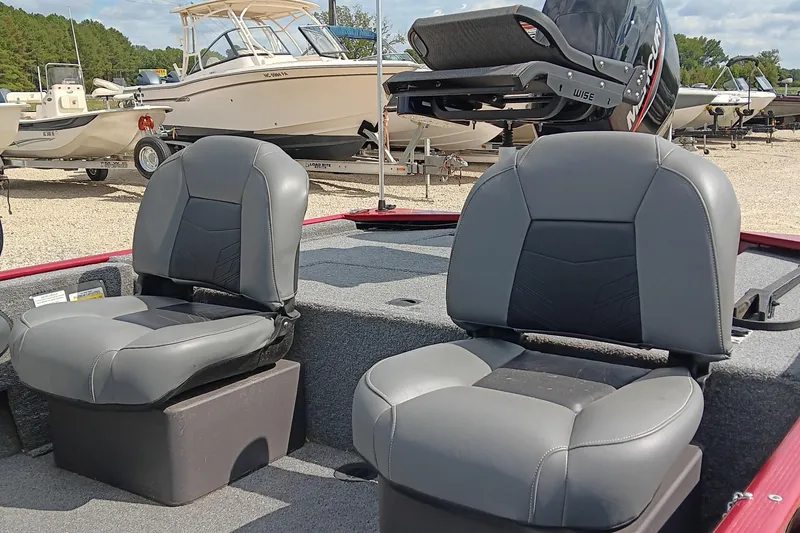 Slide: The Image of 2024 Tracker Bass Tracker Classic XL boat seats with Mercury engine in background. - 10