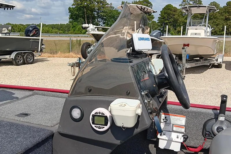 Slide: The Image of 2024 Tracker Bass Tracker Classic XL boat dashboard with steering wheel and Lowrance device. - 8
