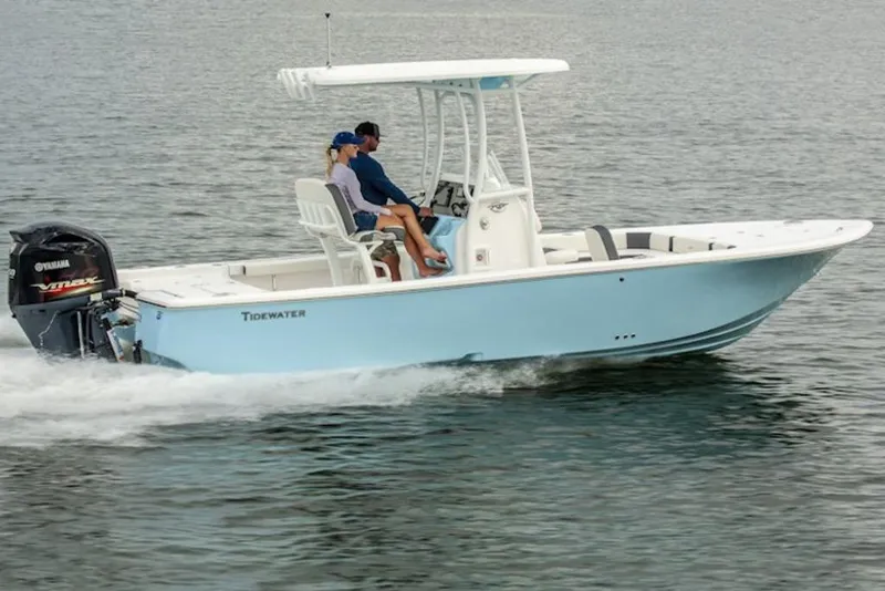 The Image of 2026 Tidewater 2300 Carolina Bay boat cruising on water with Yamaha engine. - 1