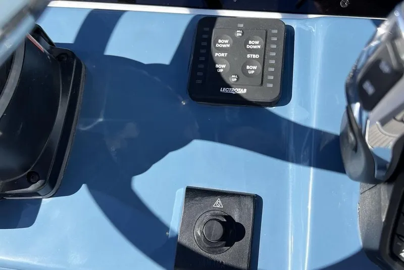 Slide: The Image of Control panel of 2026 Tidewater 2300 Carolina Bay boat with Lectrotab system. - 12