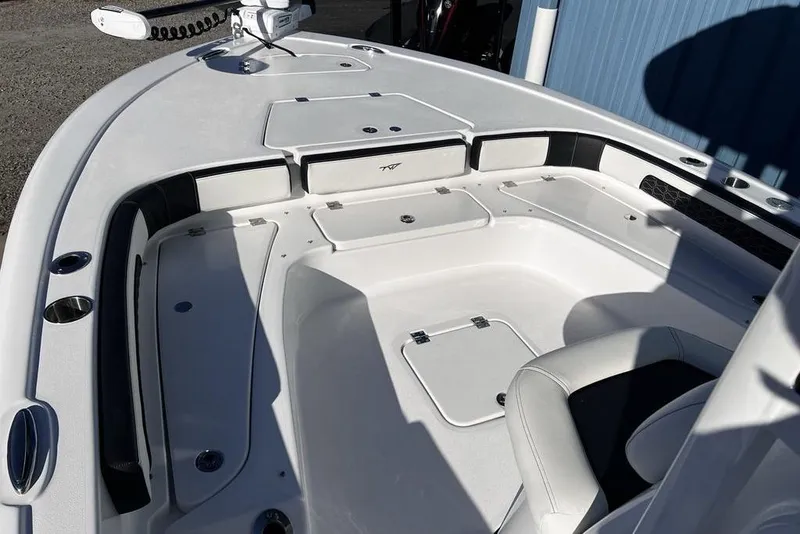Slide: The Image of 2026 Tidewater 2300 Carolina Bay boat interior with storage compartments and seating. - 18