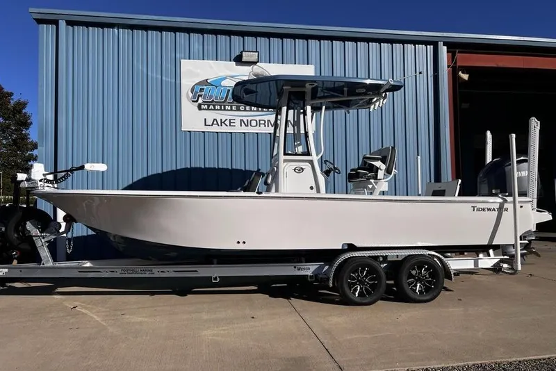 The Image of 2026 Tidewater 2300 Carolina Bay boat on trailer at marine center. - 2