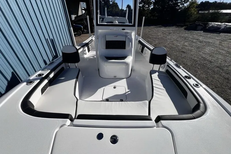 Slide: The Image of 2026 Tidewater 2300 Carolina Bay boat interior with seating and console. - 22