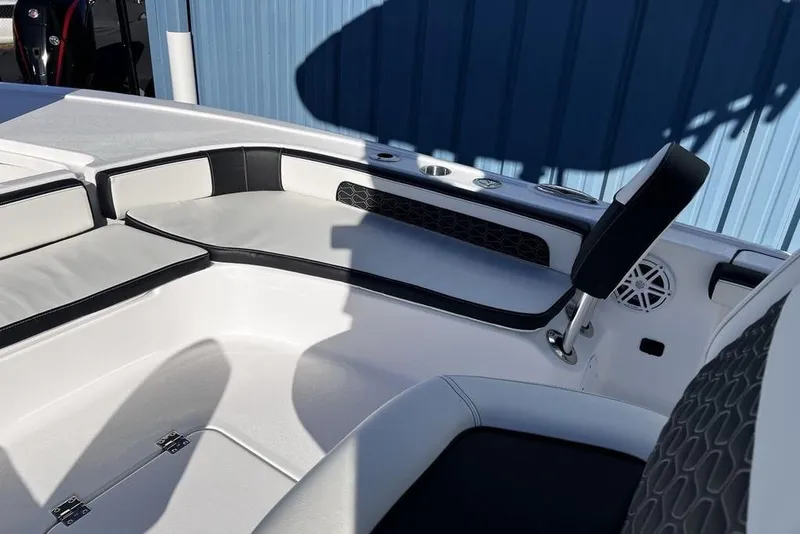 Slide: The Image of Interior of 2026 Tidewater 2300 Carolina Bay boat with cushioned seating and speaker. - 25