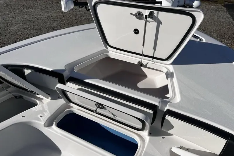 Slide: The Image of Open storage compartment on 2026 Tidewater 2300 Carolina Bay boat deck. - 26