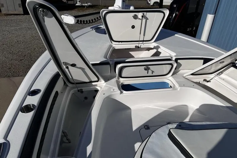 Slide: The Image of 2026 Tidewater 2300 Carolina Bay boat with open storage compartments. - 27