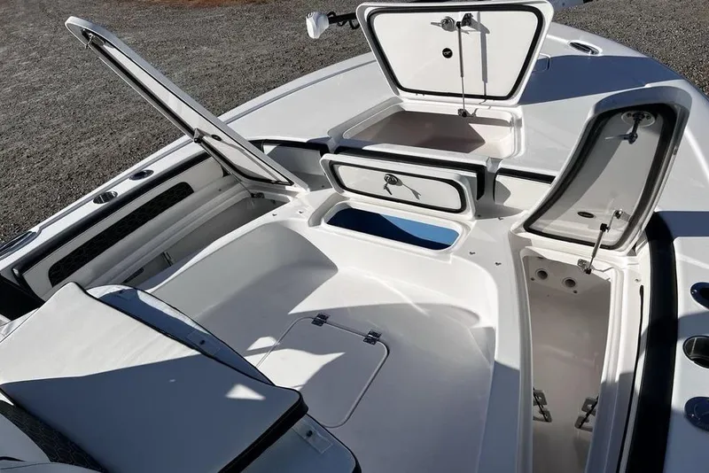 Slide: The Image of 2026 Tidewater 2300 Carolina Bay boat interior with open storage compartments. - 29
