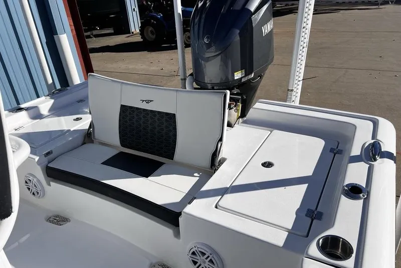 Slide: The Image of 2026 Tidewater 2300 Carolina Bay boat with Yamaha engine, featuring seating and storage compartments. - 34