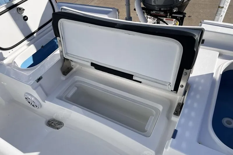 Slide: The Image of 2026 Tidewater 2300 Carolina Bay boat interior with open storage compartment. - 41