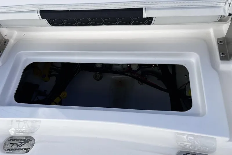 Slide: The Image of 2026 Tidewater 2300 Carolina Bay boat storage compartment, featuring sleek white interior design. - 42