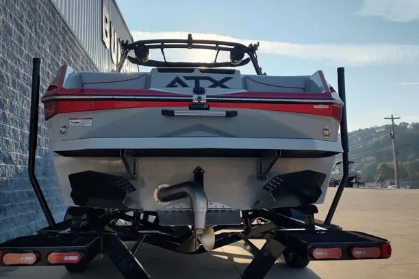 Slide: The Image of 2026 ATX Surf Boats 22 Type-S on trailer, rear view in sunlight. - 14