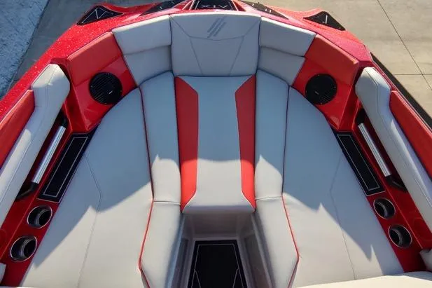 Slide: The Image of 2026 ATX Surf Boats 22 Type-S interior with red and gray seating, speakers, and cup holders. - 6