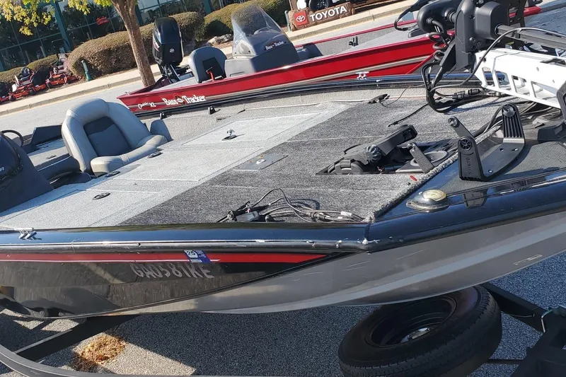 Slide: The Image of 2018 Tracker Pro Team 195 TXW 40th Anniversary Edition boat on display outdoors. - 4