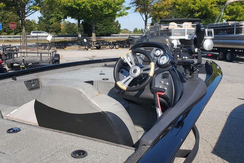 Slide: The Image of 2018 Tracker Pro Team 195 TXW 40th Anniversary Edition boat interior with steering wheel. - 5