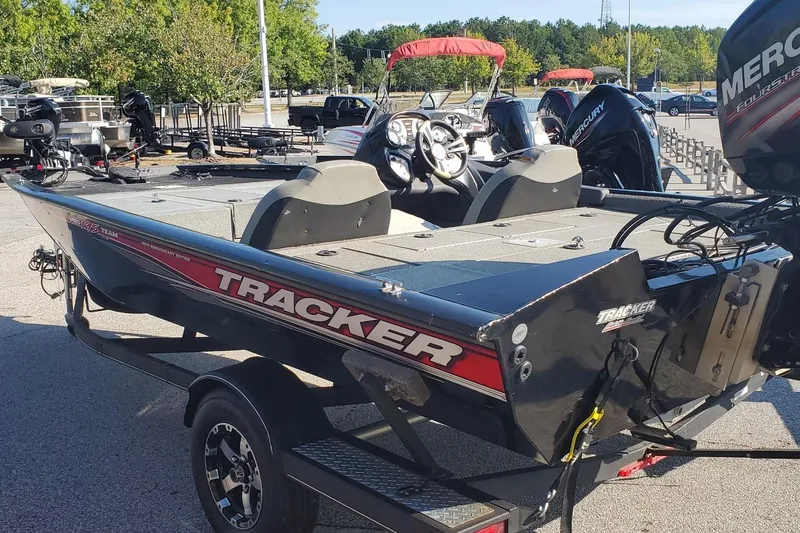 Slide: The Image of 2018 Tracker Pro Team 195 TXW 40th Anniversary Edition boat in parking lot. - 6