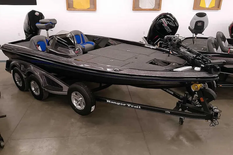 The Image of 2025 Ranger Z518 Ranger Cup Equipped boat on trailer in showroom. - 1