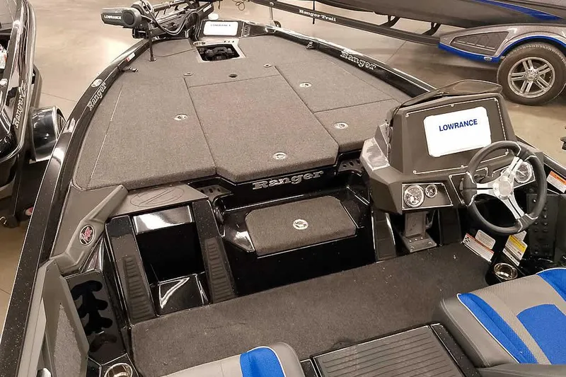Slide: The Image of 2025 Ranger Z518 Ranger Cup Equipped boat interior with Lowrance electronics and seating. - 10