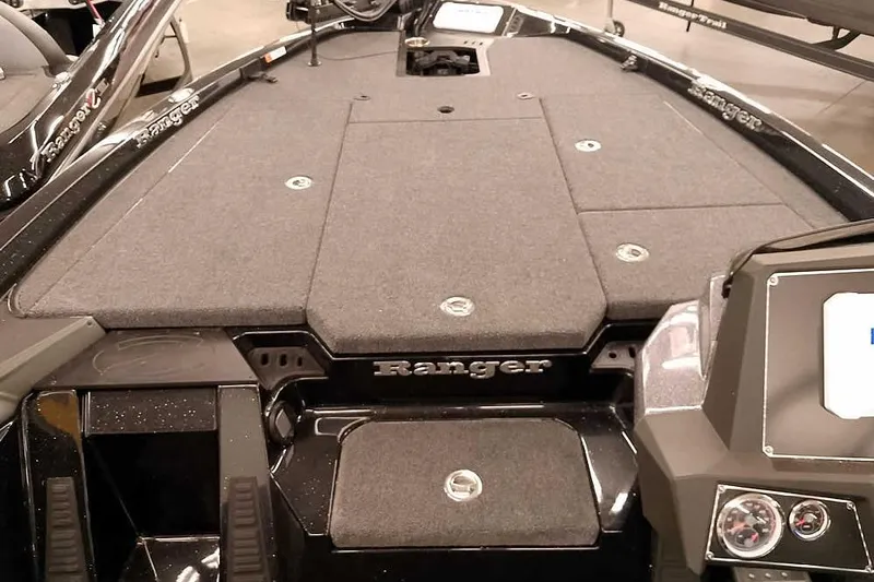 Slide: The Image of 2025 Ranger Z518 Ranger Cup Equipped boat deck with storage compartments. - 11